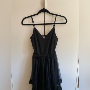 Small Elegant Black Dress with Floral Detailing toward the bottom